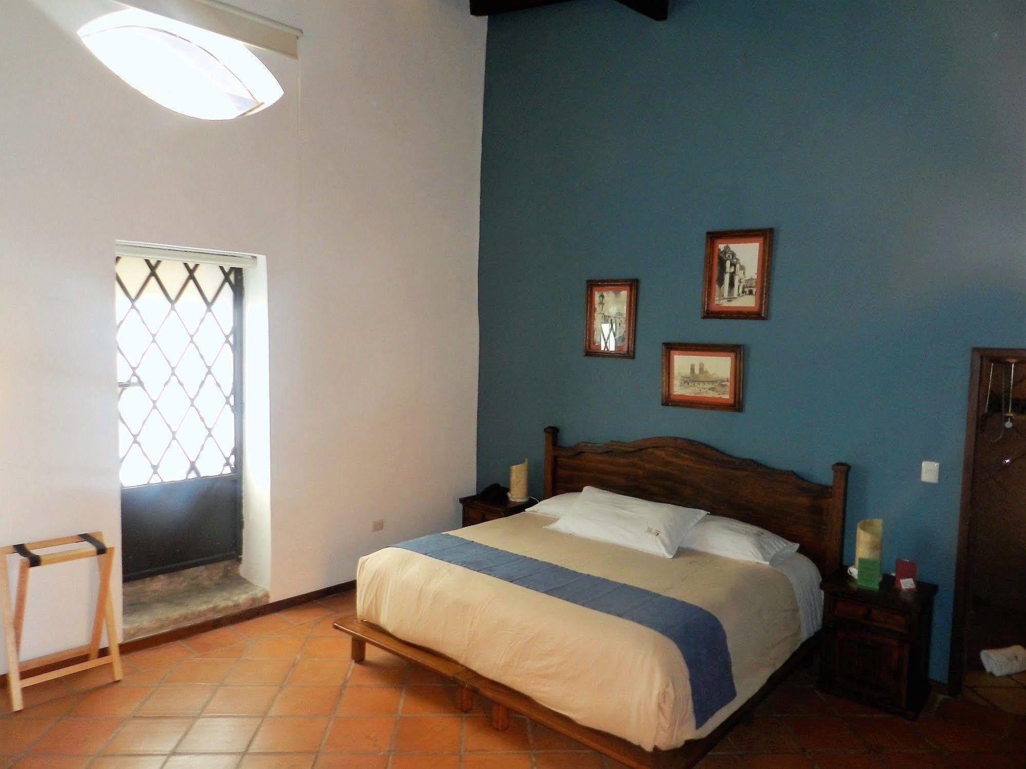Collection O Al Otro Lado Del Rio, Puebla Hotel Luaran gambar A room at Hotel San Cristóbal