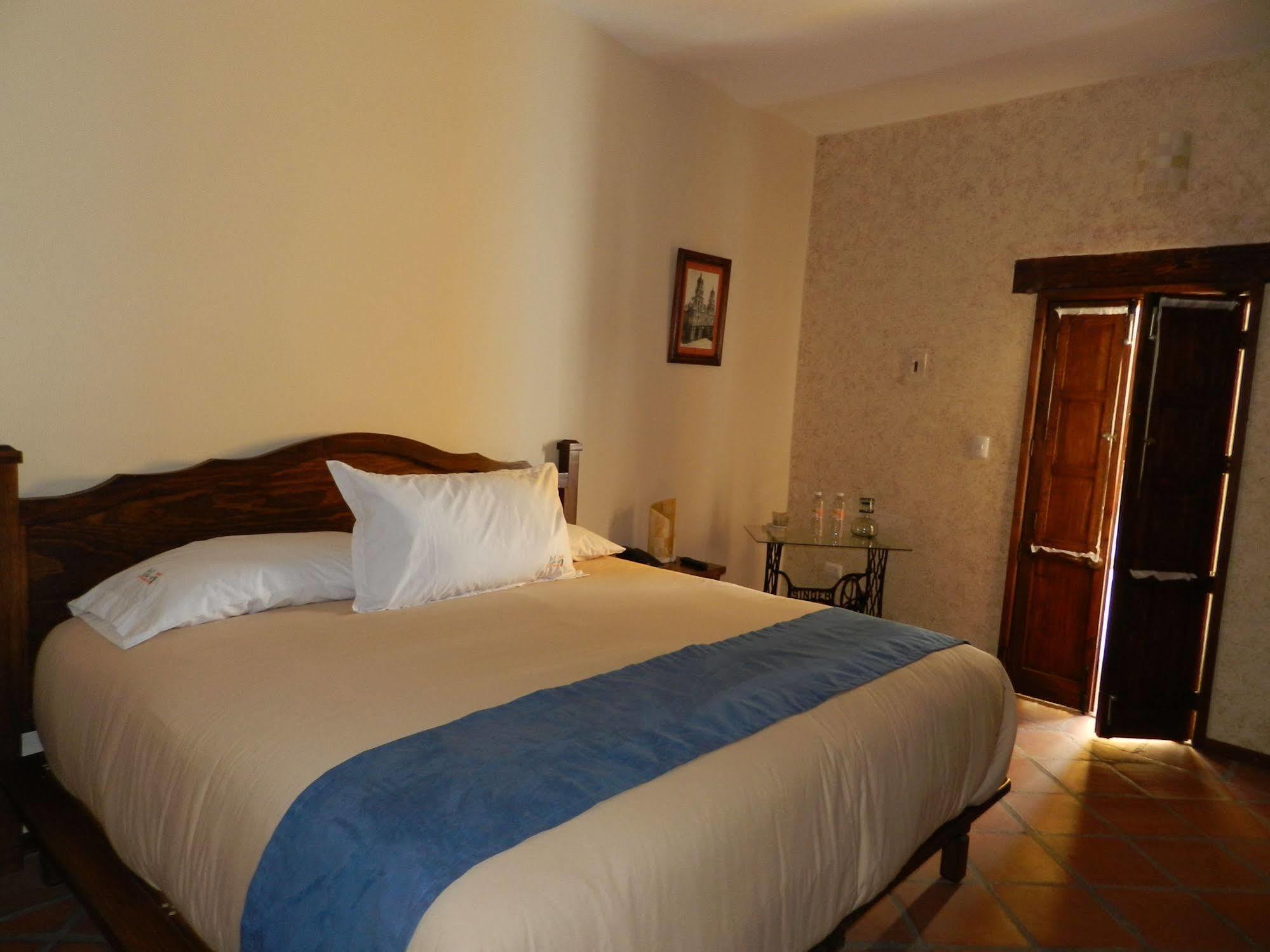 Collection O Al Otro Lado Del Rio, Puebla Hotel Luaran gambar A bedroom at the hotel