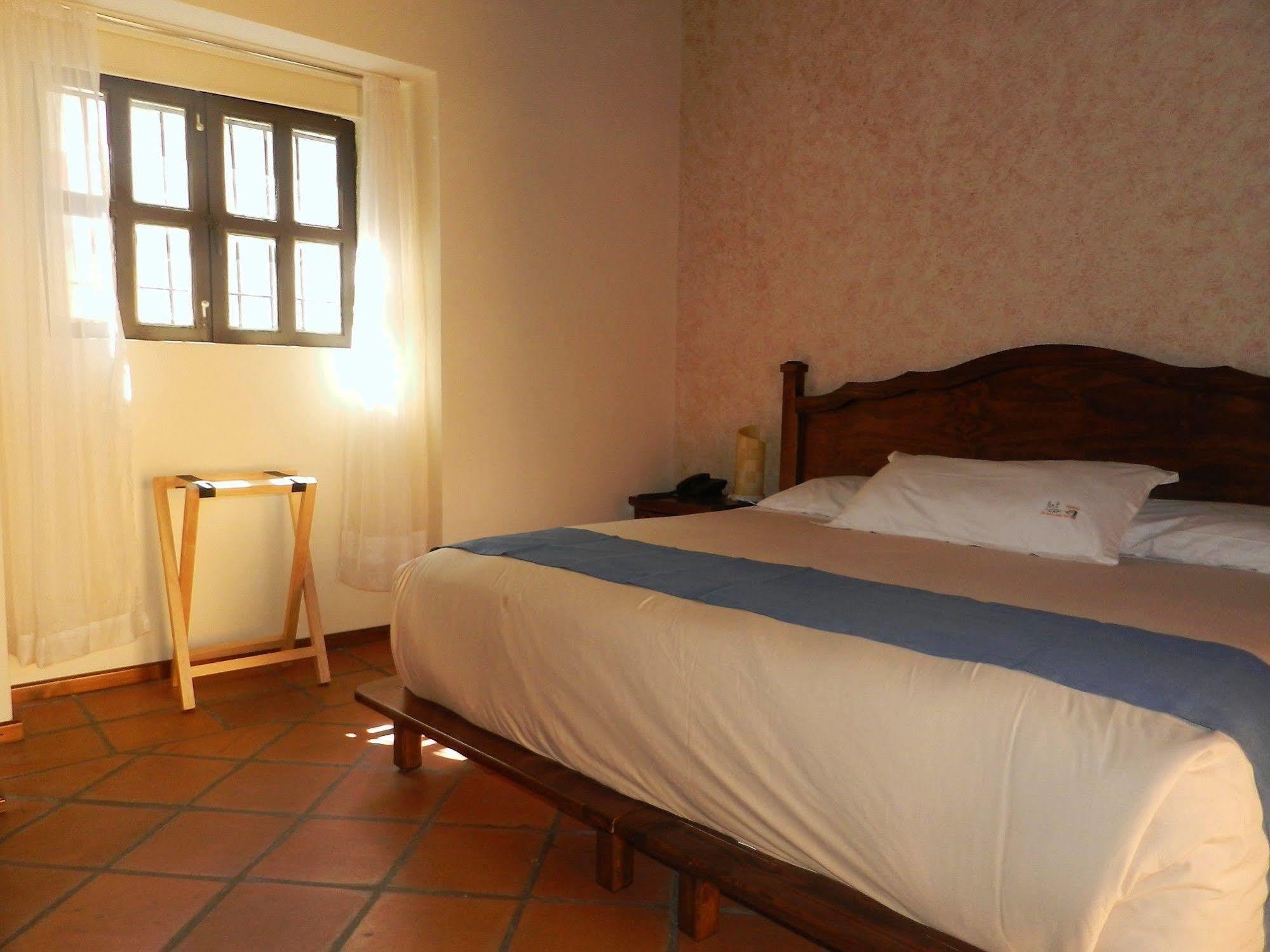 Collection O Al Otro Lado Del Rio, Puebla Hotel Luaran gambar A room at Hotel San Cristóbal